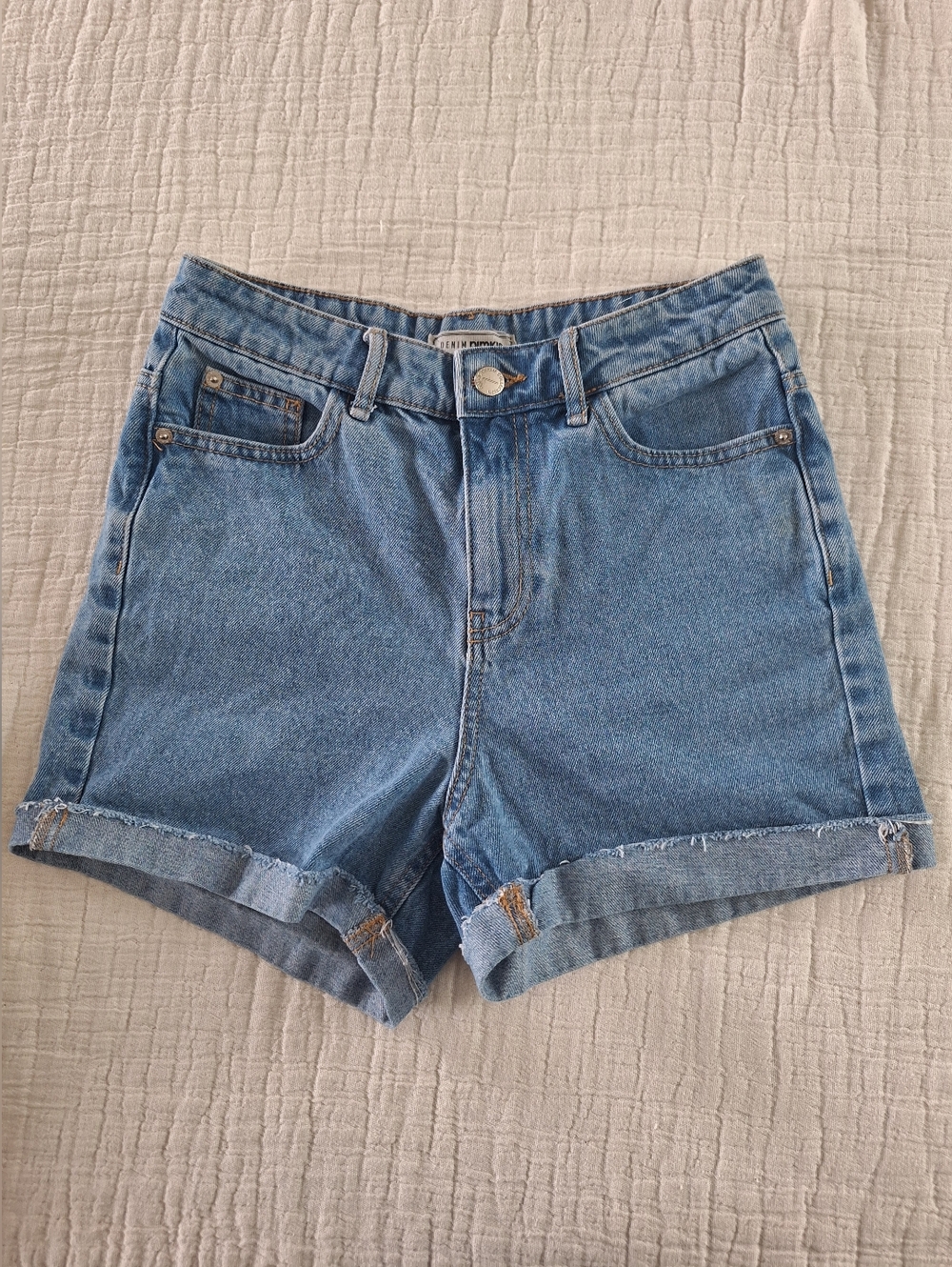 High-Rise Rolled Hem Jean Shorts in Medium Blue